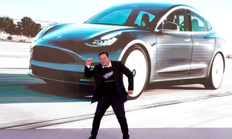 Elon Musk dances onstage during a delivery event for Tesla in Shanghai, China, in 2022.