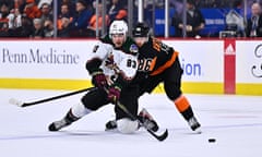 Arizona Coyotes center Adam Ruzicka (83) battles for the puck against Philadelphia Flyers left wing Joel Farabee (86) of the first period of game this month at Wells Fargo Center.
