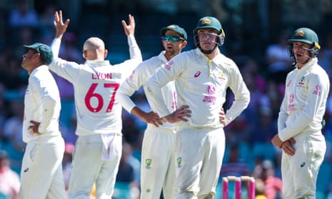 Australia’s Nathan Lyon (second left) reacts with his teammates after the third umpire’s decision for a catch by Steve Smith during the third Test at the SCG.