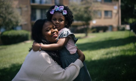 Rashida Taylor with her four-year-old daughter Riley outside of their home in Washington DC on 19 August.