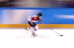 Hana Kubo of Japan controls the puck against Sweden.