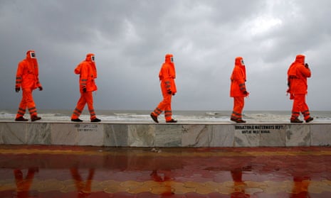 National disaster response workers patrol the shore in West Bengal ahead of Cyclone Yaas.