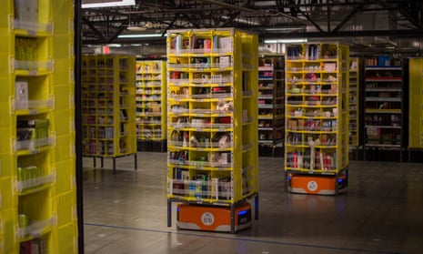 Kiva robots transport goods at an Amazon Fulfillment Center, ahead of the Christmas rush, in Tracy, California in November 2014