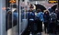 Passengers prepare to board a train at a station in London, Britain, 04 April 2024. 