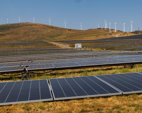 Solar panels and wind farms.