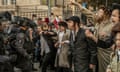 Ultra-Orthodox young men clash with police in Jerusalem during a protest against the plans.