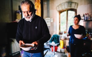 Hovig Samra carries a bowl of soup inside the kitchen of his restaurant in Stepanakert