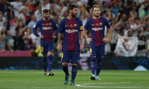 Whilst Lionel Messi and his Barcelona team-mates look bewildered.