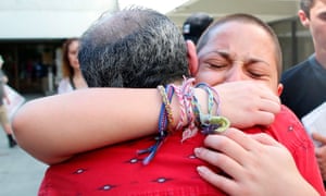 Marjory Stoneman Douglas student Emma González hugs her father after speaking at a rally. 