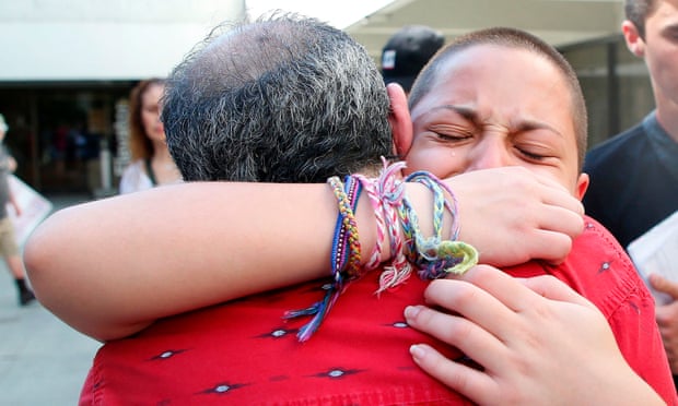 Marjory Stoneman Douglas student Emma González hugs her father after speaking at a rally. 