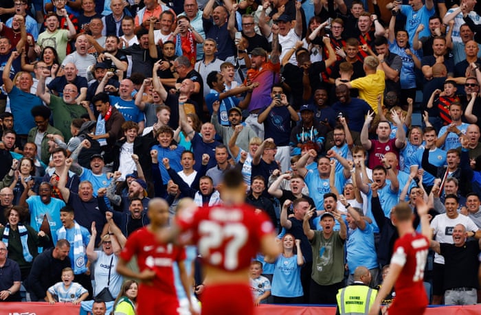 Manchester City fans celebrate after Manchester City's Julian Alvarez scores their equalizer.
