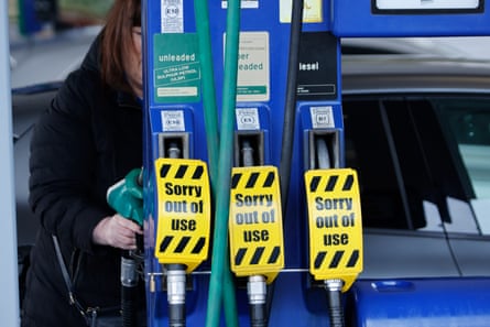 A filling station with signs saying pumps out of use.