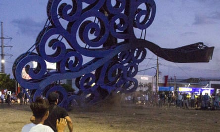 Protesters haul down a ‘Tree of Life’ sculpture in Managua, Nicaragua