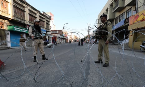 Indian paramilitary soldiers stand guard in the old city of Jammu.