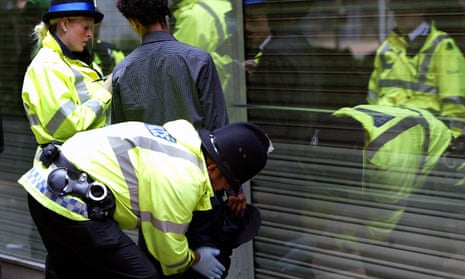 Police search a suspected drug dealer in the northern quarter of Manchester.