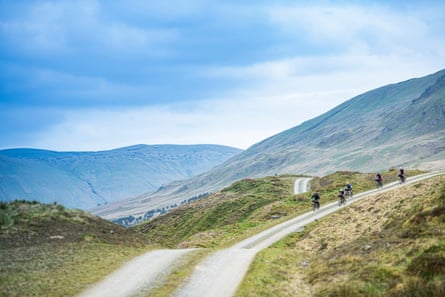Open country with hills and cyclists in the background