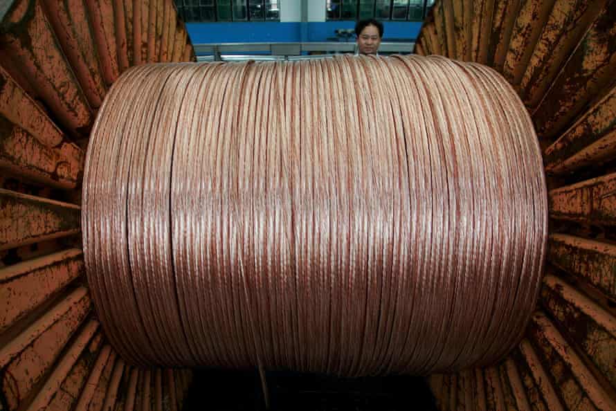 An employee works at an electricity cable factory in Baoying, Jiangsu province, China.