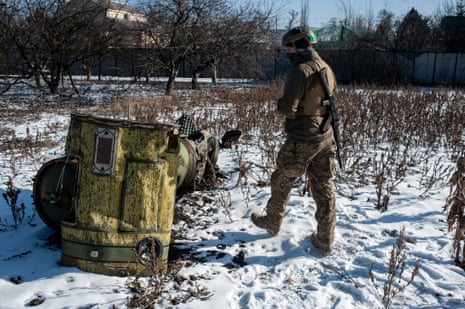 A Ukrainian service member checks parts of a Tochka-U ballistic missile in Bakhmut.