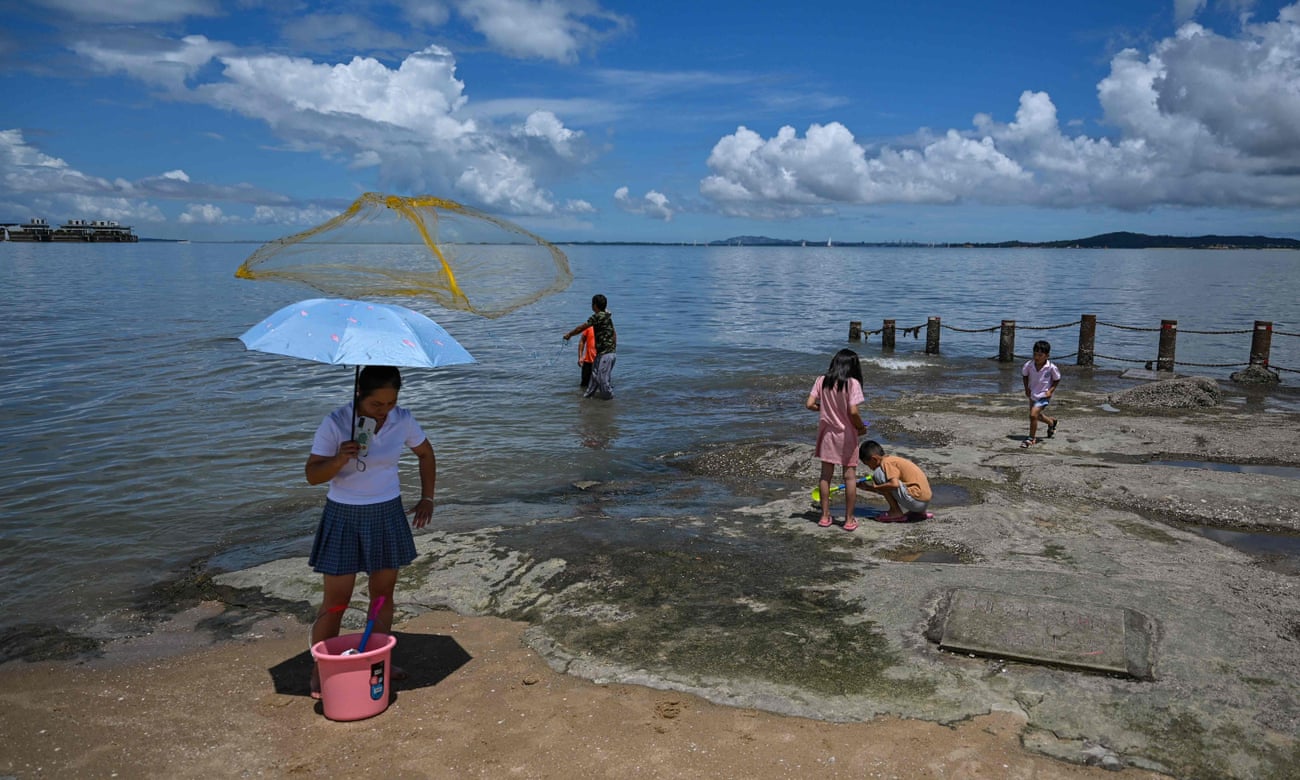 Beachgoers this month in Xiamen, China, just across the waters from Taiwan's Kinmen islands, a potential flashpoint in the conflict with Beijing