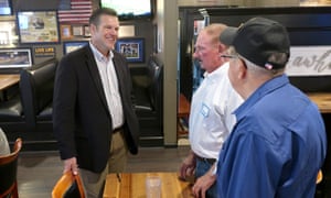 Kris Kobach, left, a Republican candidate for the US Senate in Kansas, speaks with supporters in Holton, Kansas.