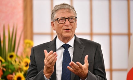 Bill Gates gestures as he gives a speech