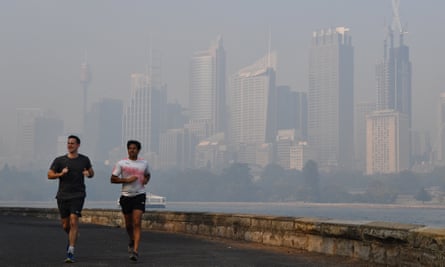 runners against a hazy Sydney skyline