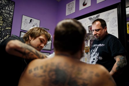 TM Garret watches as tattoo artist Trevor Curbo works on a coverup of the swastika on Nate Greer’s chest at Sickside Tattoo Studio in Horn Lake, MS on Wednesday, January 16, 2019.