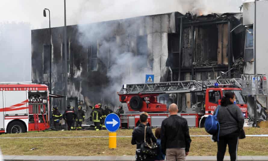 Firefighters work on the site of the plane crash.