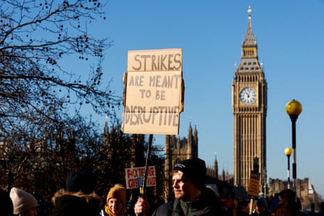 People hold placards during NHS nurses' strike