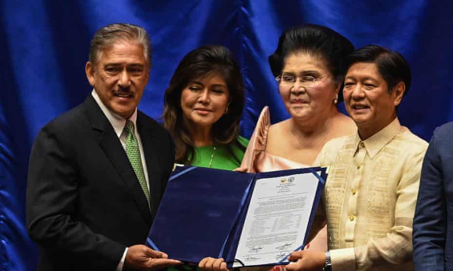 Ferdinand Marcos Jr (right) is proclaimed president-elect alongside senate president Vicente Sotto III, left, as Imelda and Imee Marcos look on.