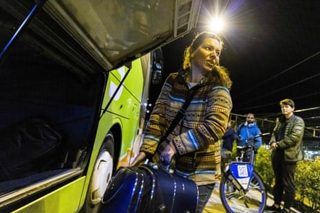 A passenger puts her suitcase into a Flixbus departing from Maastricht station in the Netherlands for Kyiv. The company has resumed journeys to Ukraine.