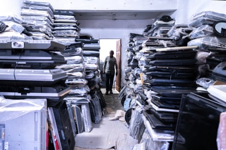 A storage room full of TVs and computers