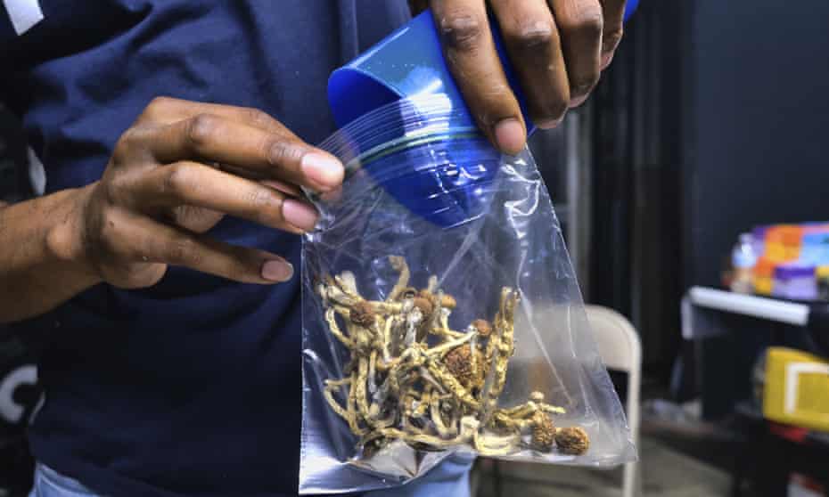 A vendor bags psilocybin at a pop-up cannabis market in Los Angeles. In 2020, after a landmark US-first vote, Oregon legalized the therapeutic use of psilocybin.