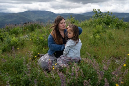 Denia sits with her daughter Evelyn at their favorite lookout-spot in Hoopa that looks out over the entire Hoopa Valley.