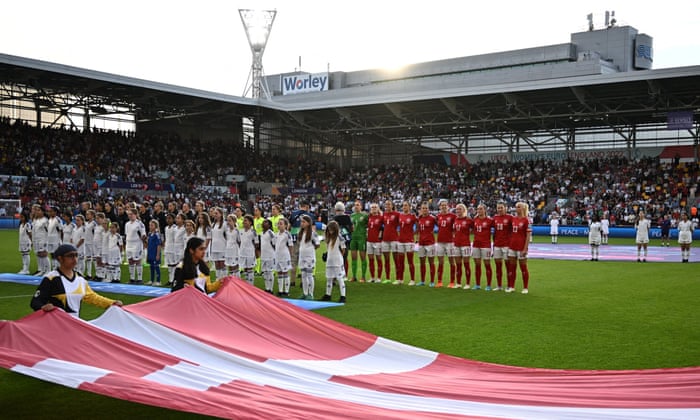 The players line up ahead of kick-off.