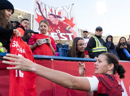 Christine Sinclair signs autographs for fans following her final appearance for Canada, against Brazil, on 28 October.