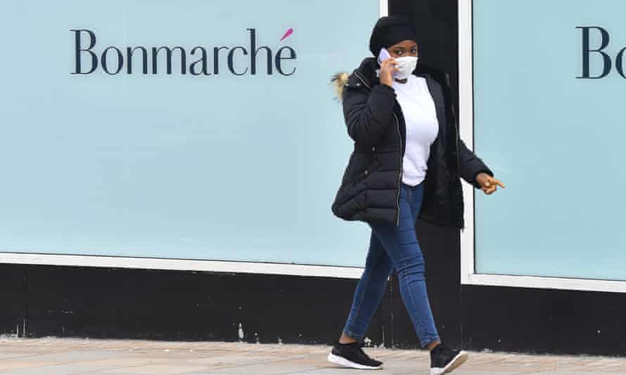 A woman walks past the shop front of clothes retailer Bonmarche in Stoke-on-Trent, Staffordshire.