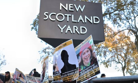 Placards of women victims are seen displayed outside the New Scotland Yard during a protest against the police brutality against women.