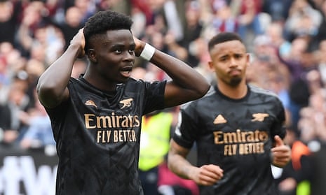 Bukayo Saka (left) reacts after missing a chance to score from the penalty spot against West Ham