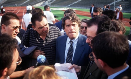 Bernard Tapie, in his role as club president, giving a media interview at an Olympique de Marseille match.