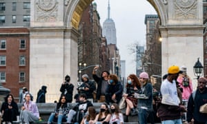 People wearing protective masks are seen in Washington Square park in New York City as mayor Bill de Blasio vows there will be “no more shutdowns” in America’s most populous city.