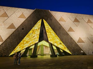 glowing exterior of Grand Egyptian Museum