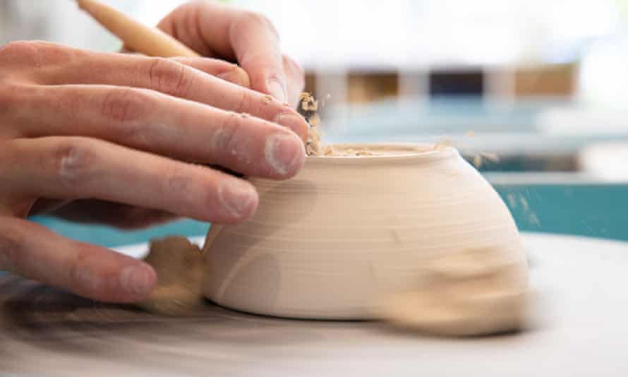 A potter works on a wheel at Bondi Clay