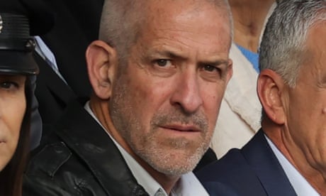 Ronen Bar sitting in a row of people