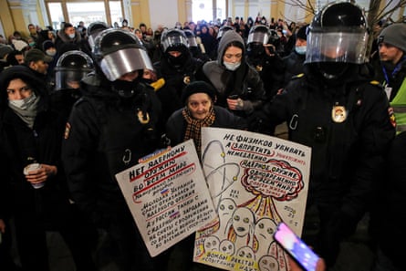 Law enforcement officers escort an elderly artist and activist, Yelena Osipova, during an anti-war protest against Russia’s invasion of Ukraine, in Saint Petersburg, Russia March 2, 2022.