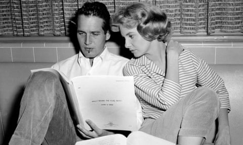 Paul Newman and wife Joanne Woodward reading a script at home in California in 1958.