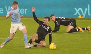 Jack Grealish slides into Kevin de Bruyne.