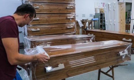 A worker assembles a coffin. Direct cremations accounted for 14% of all funerals in 2020, up from 3% in 2019. 
