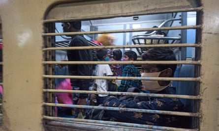 Children aboard a train leave for industrial cities for work.