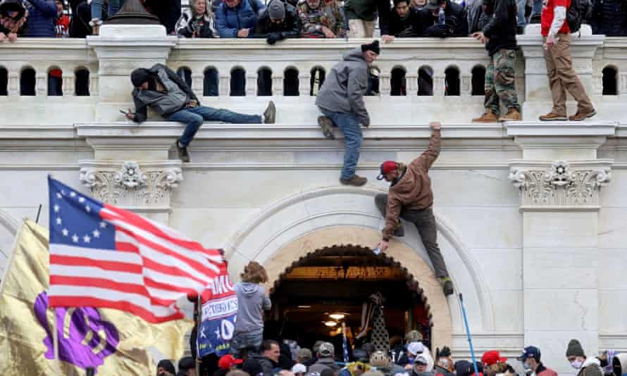 A mob of Trump supporters storms the US Capitol on 6 January 2021.